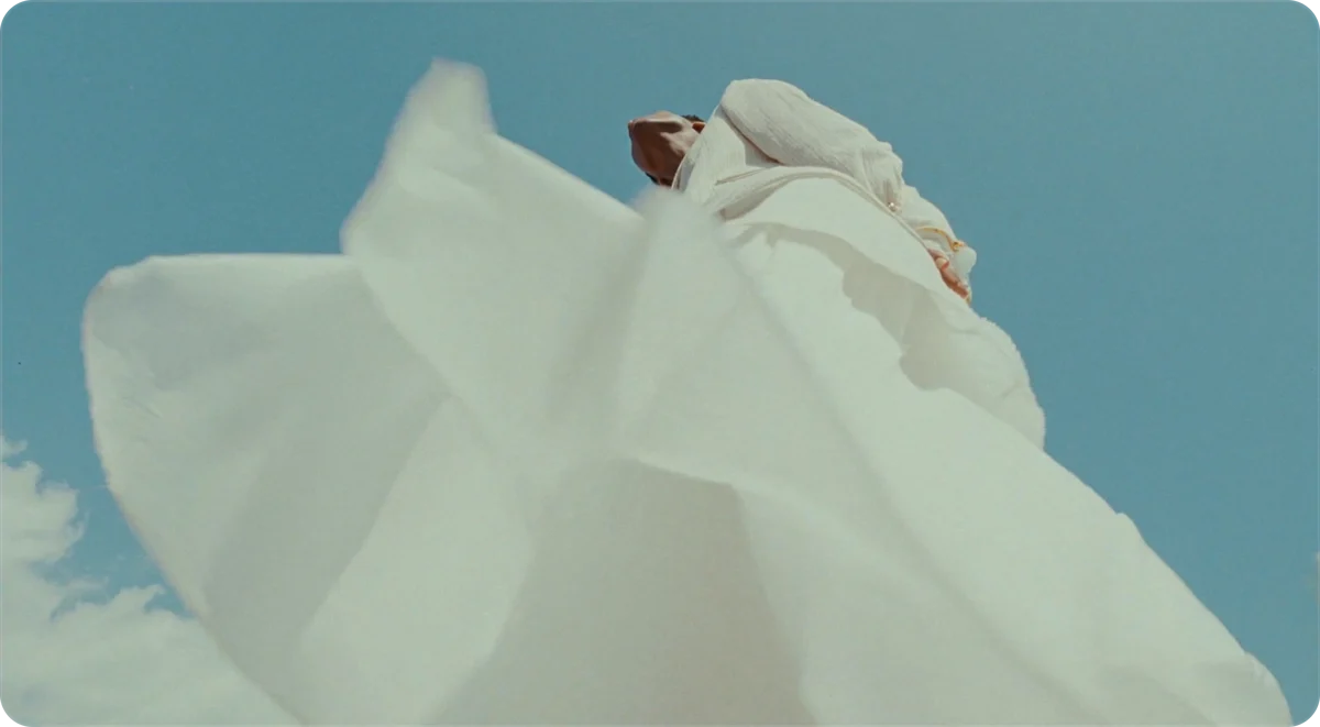 Draped fabric lit on a pedestal