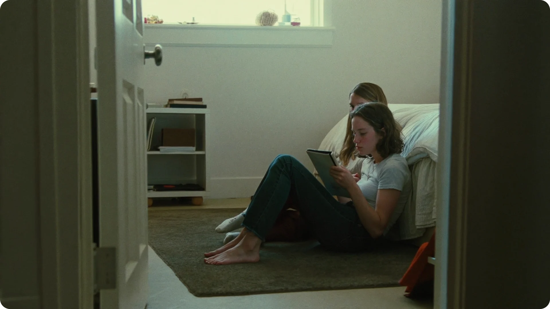 A person reading in a softly lit room